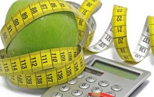 Manzana, cinta métrica y calculadora